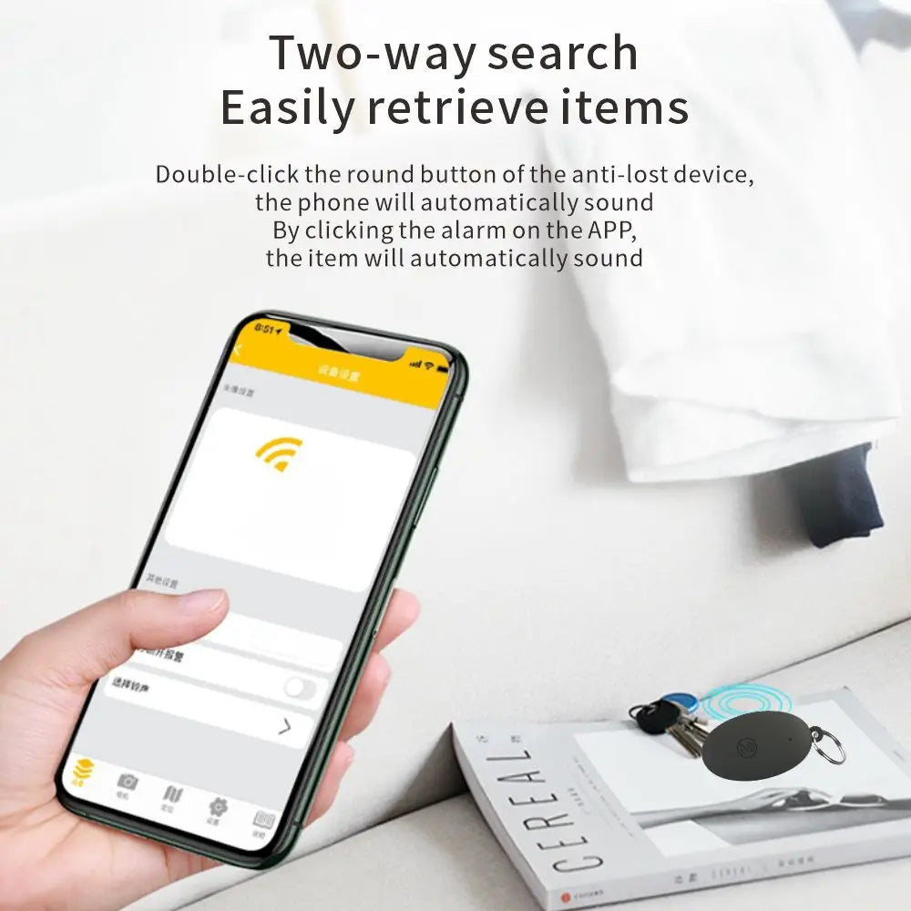 Smartphone connected to GPS tracker for keys using two-way search feature, showing phone and tracker communication on a desk with keys