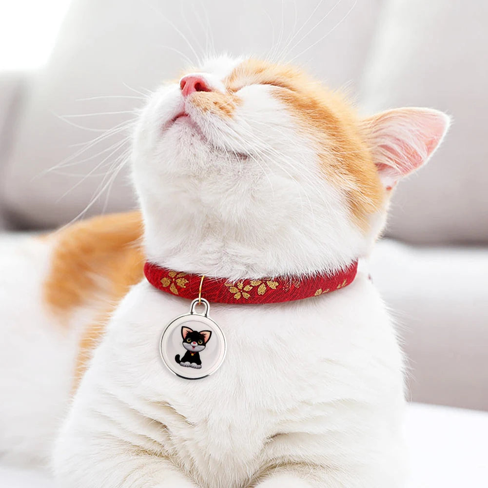 Cat with a red floral collar wearing a cute cat-themed GPS tracker for pet monitoring